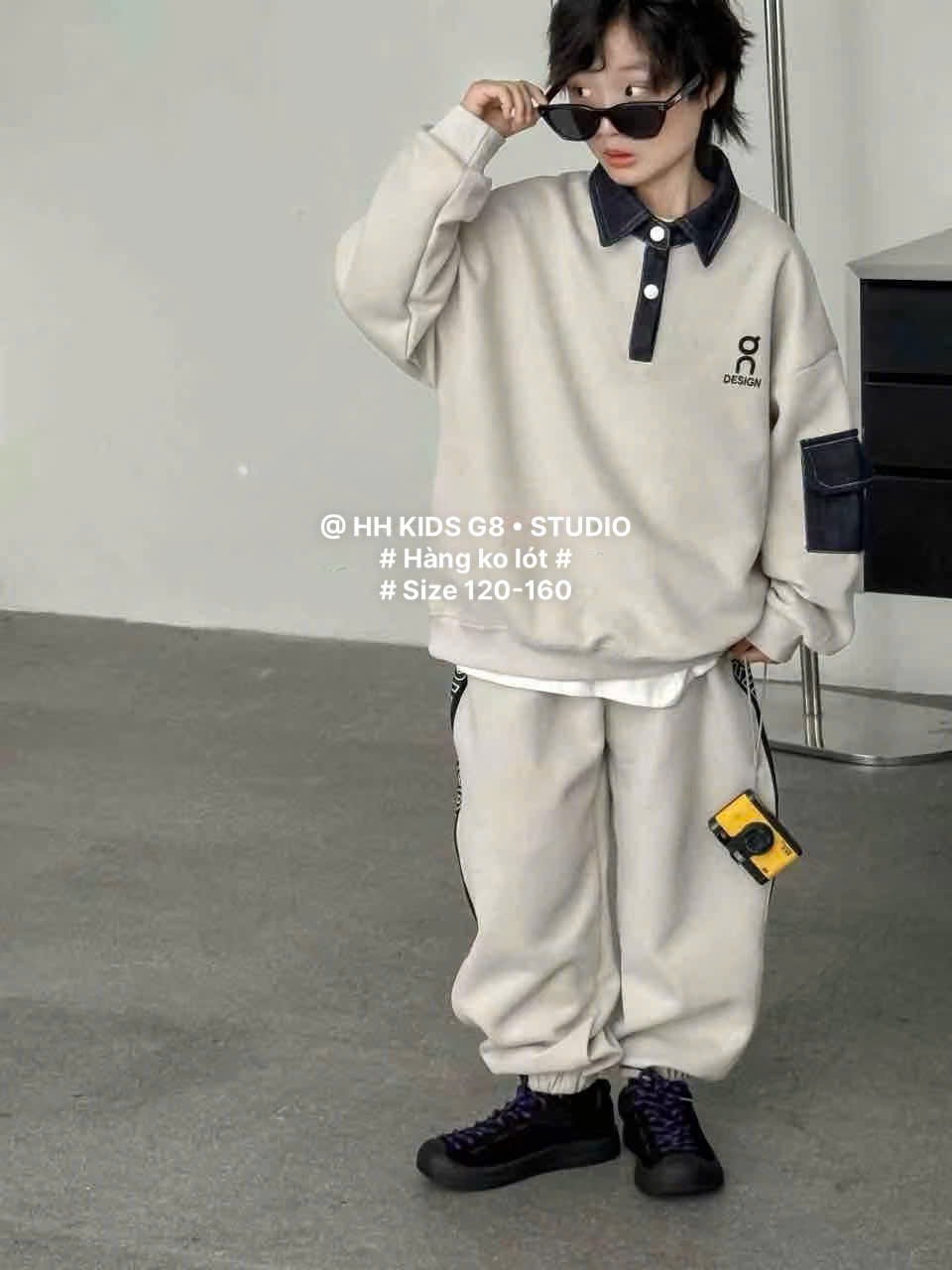 D312 - Bộ nỉ hai da cổ đức tay phối hai màu đen/be bé trai size 120-160