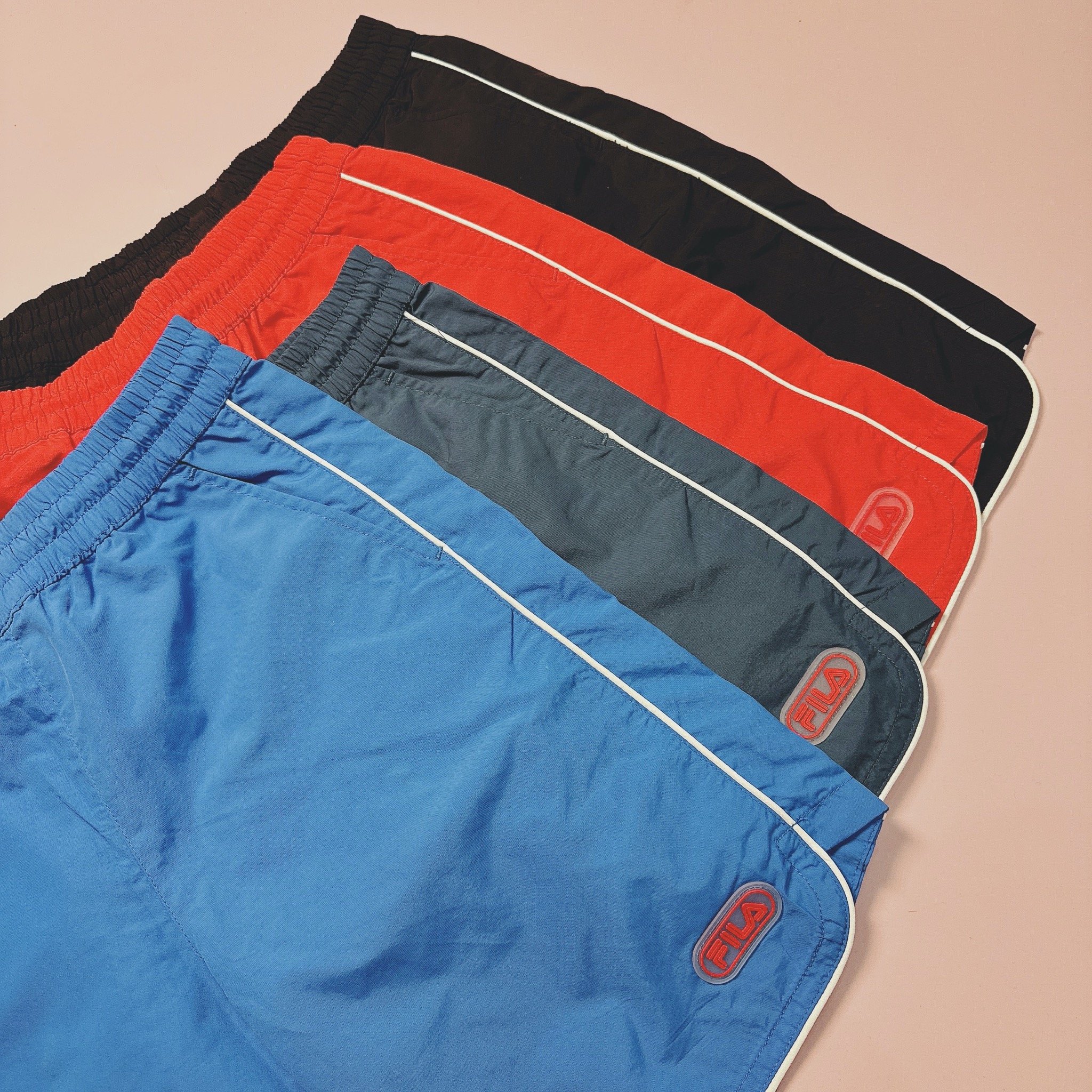 Quần gió đi biển F.i.l.a viền trắng 4 màu BT size 100 - 165