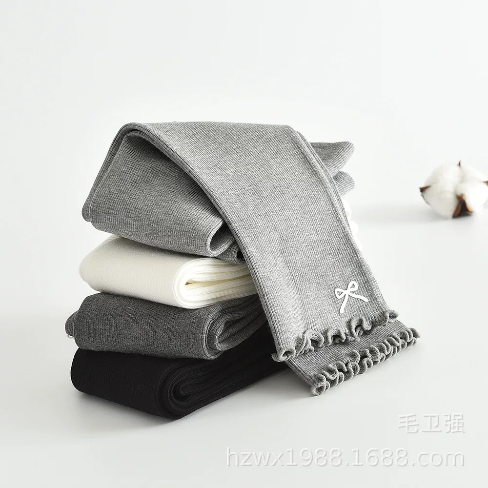 Quần len không bàn đính nơ gấu cho bé gái size 90-135cm