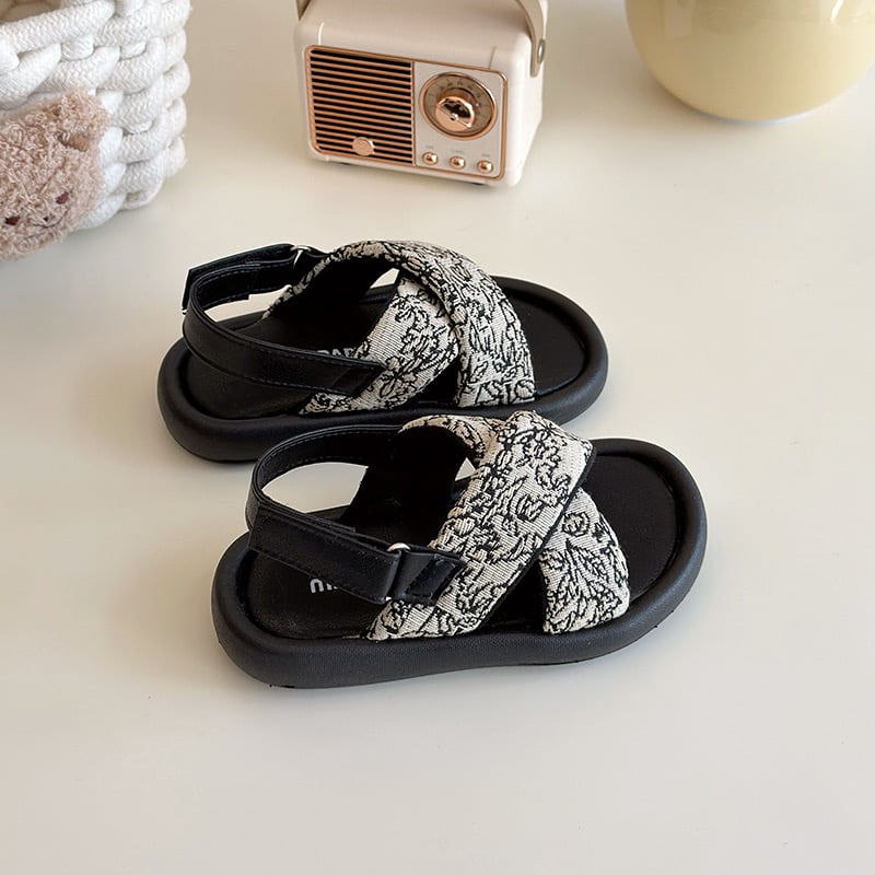 V1026 - Sandal MGbaby quai chéo 2 màu đen, trắng hoa bé gái size 21-30