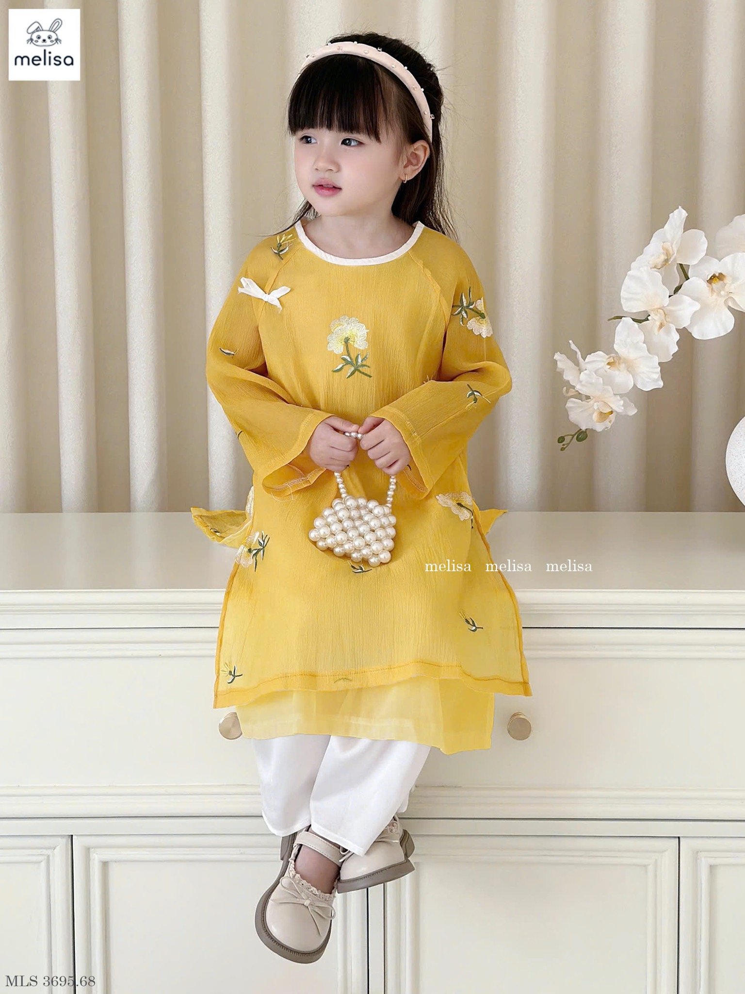 MLS 3695 - Áo dài Melisa màu vàng thêu hoa bé gái size 2-12y