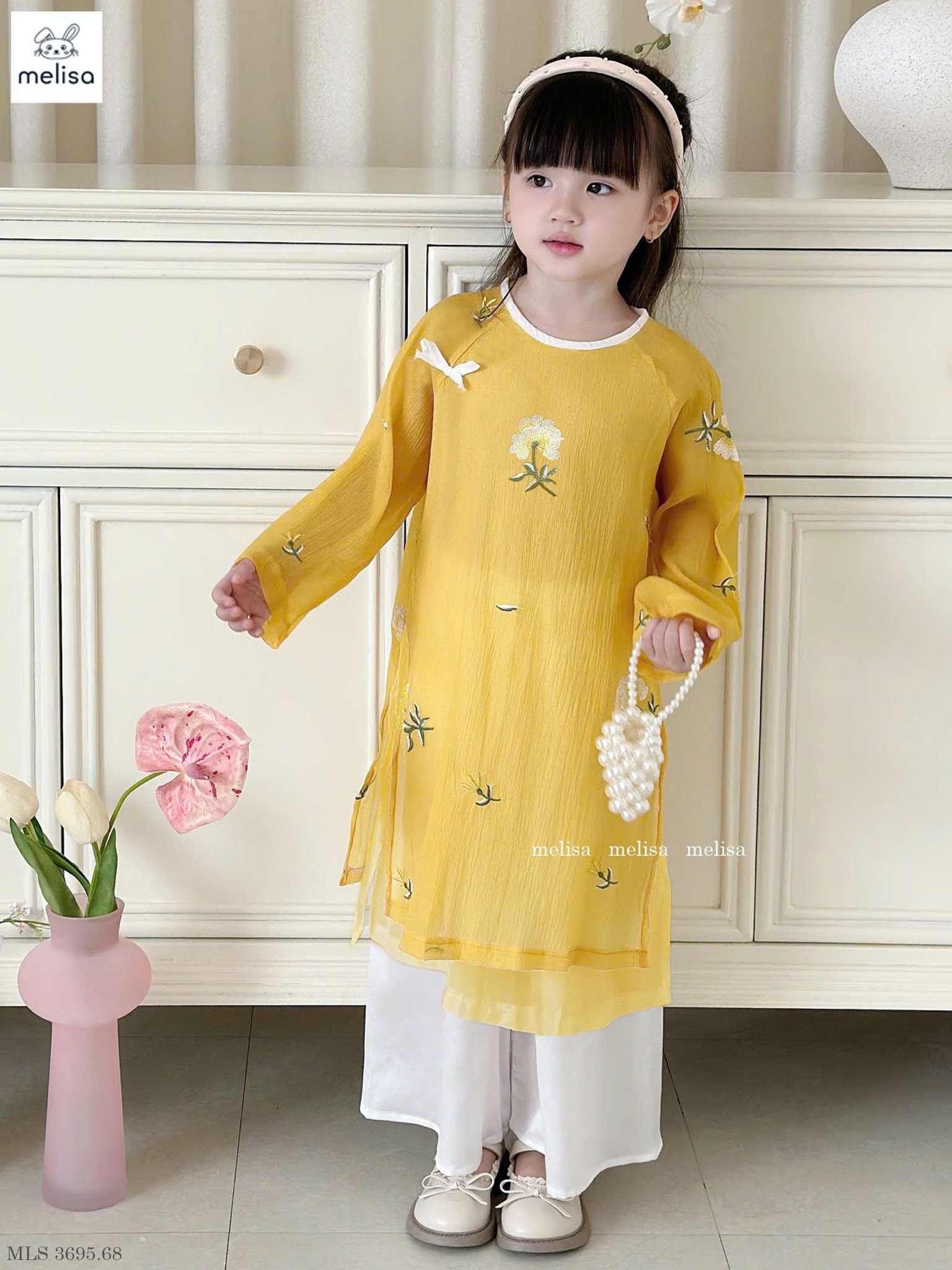 MLS 3695 - Áo dài Melisa màu vàng thêu hoa bé gái size 2-12y