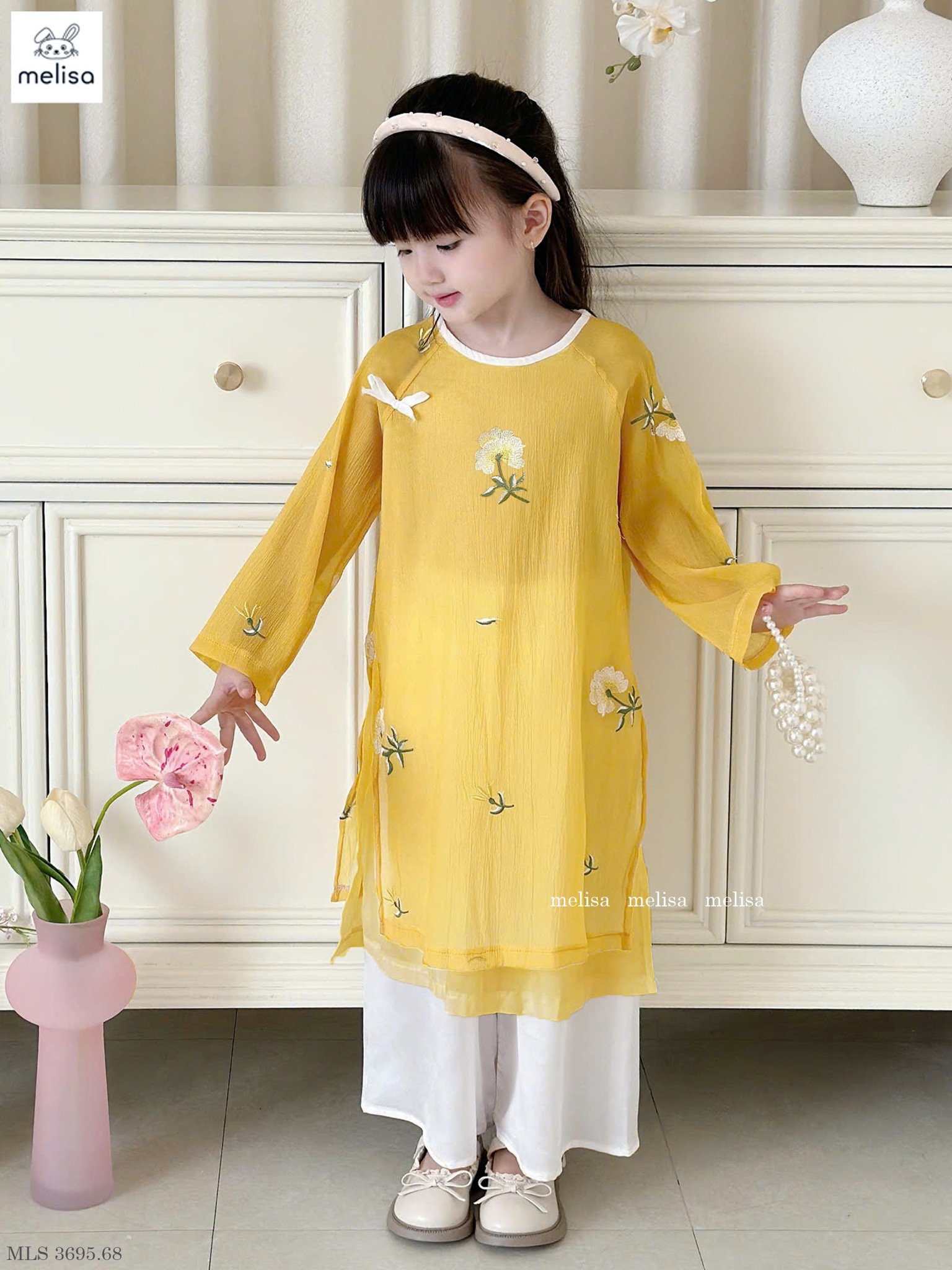 MLS 3695 - Áo dài Melisa màu vàng thêu hoa bé gái size 2-12y