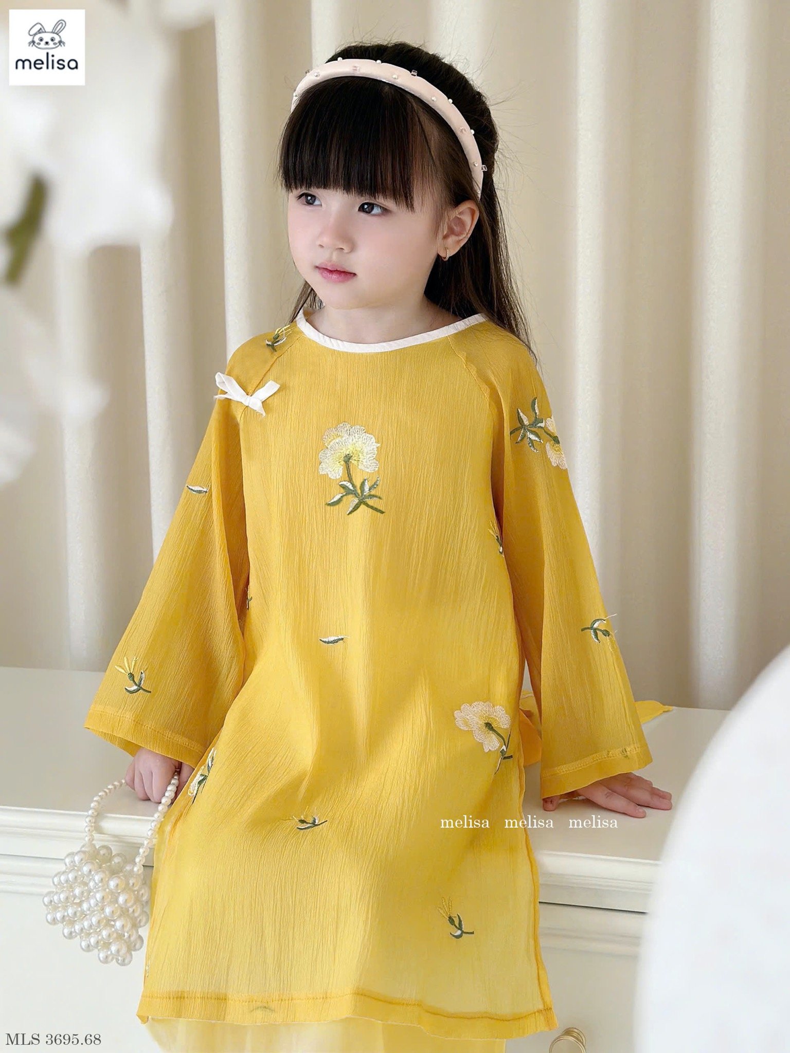 MLS 3695 - Áo dài Melisa màu vàng thêu hoa bé gái size 2-12y