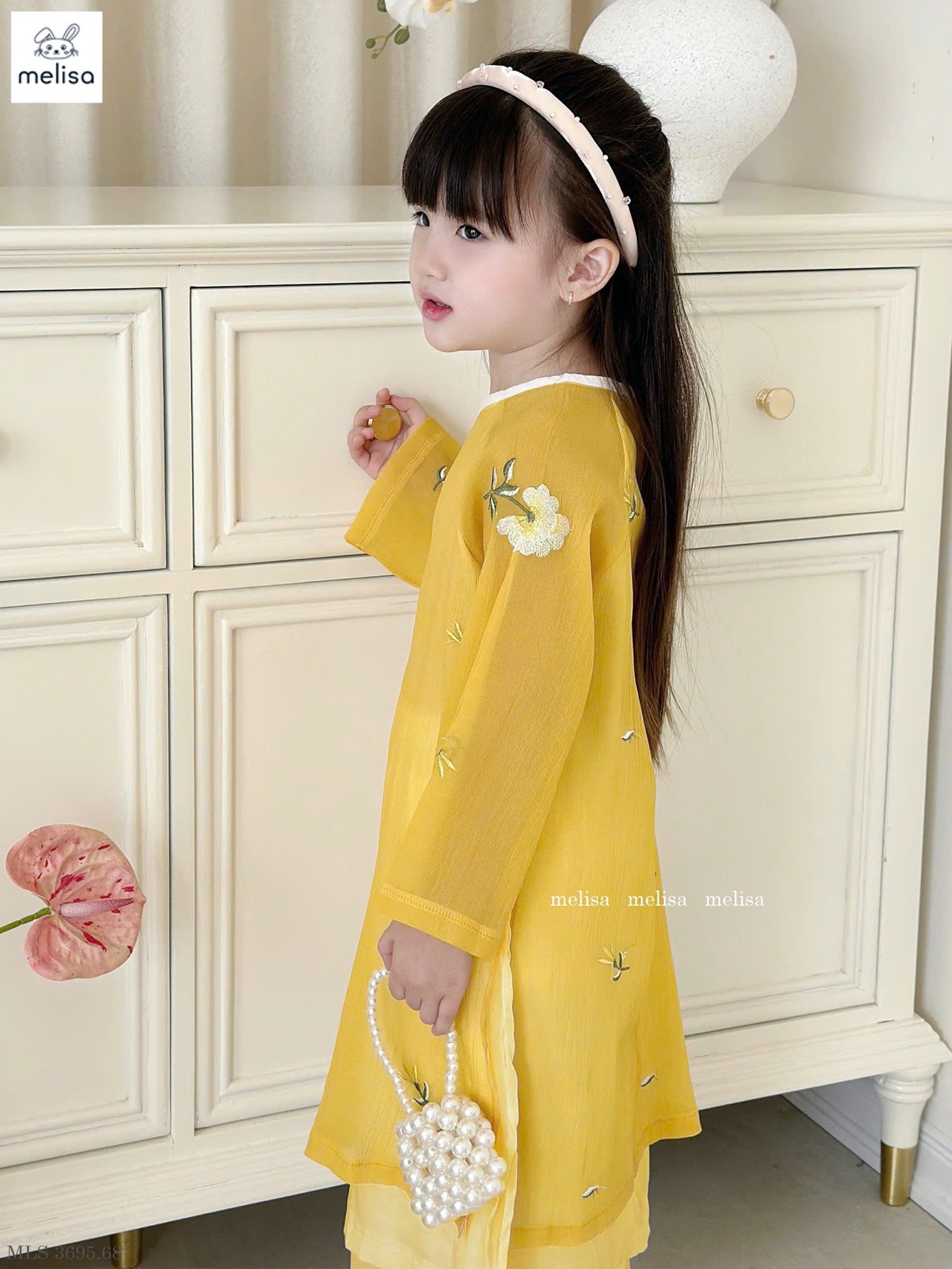 MLS 3695 - Áo dài Melisa màu vàng thêu hoa bé gái size 2-12y