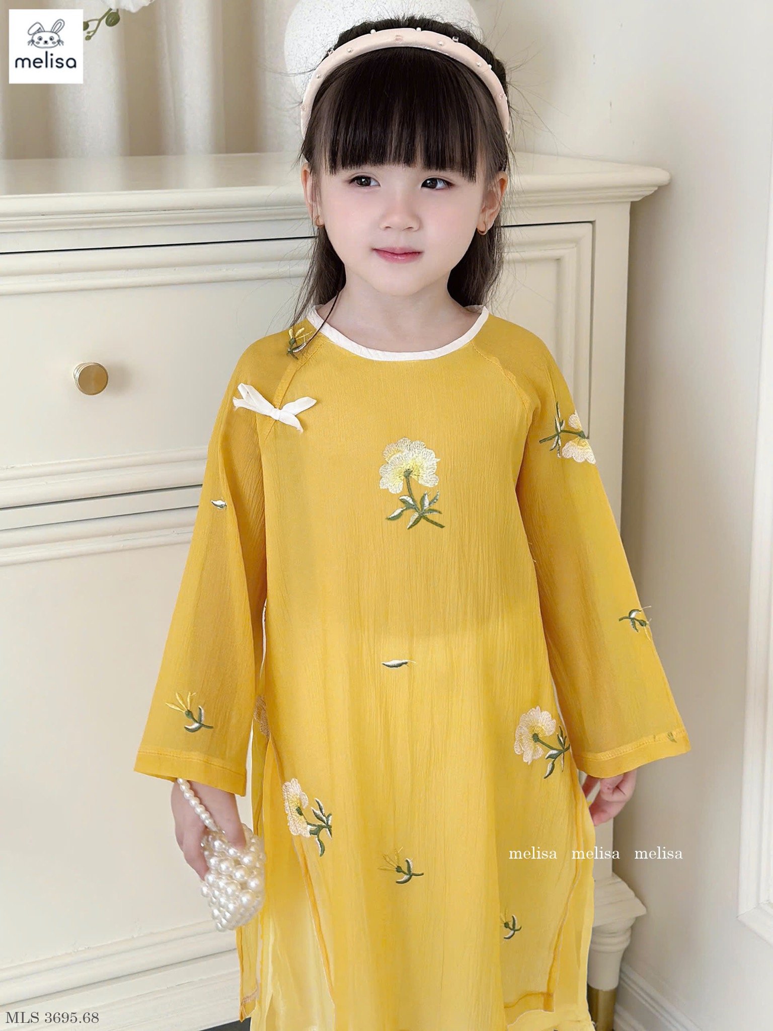 MLS 3695 - Áo dài Melisa màu vàng thêu hoa bé gái size 2-12y