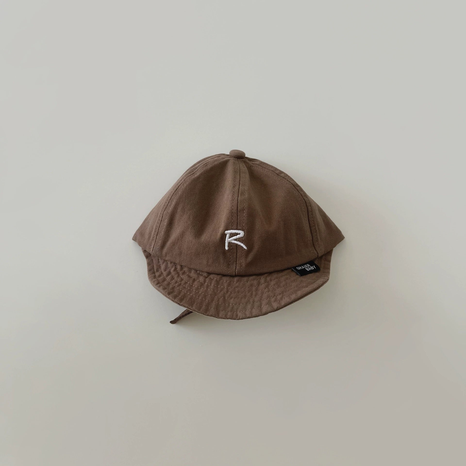 Mũ lưỡi le vành mềm chữ R nhiều màu BTBG size 6m-2y