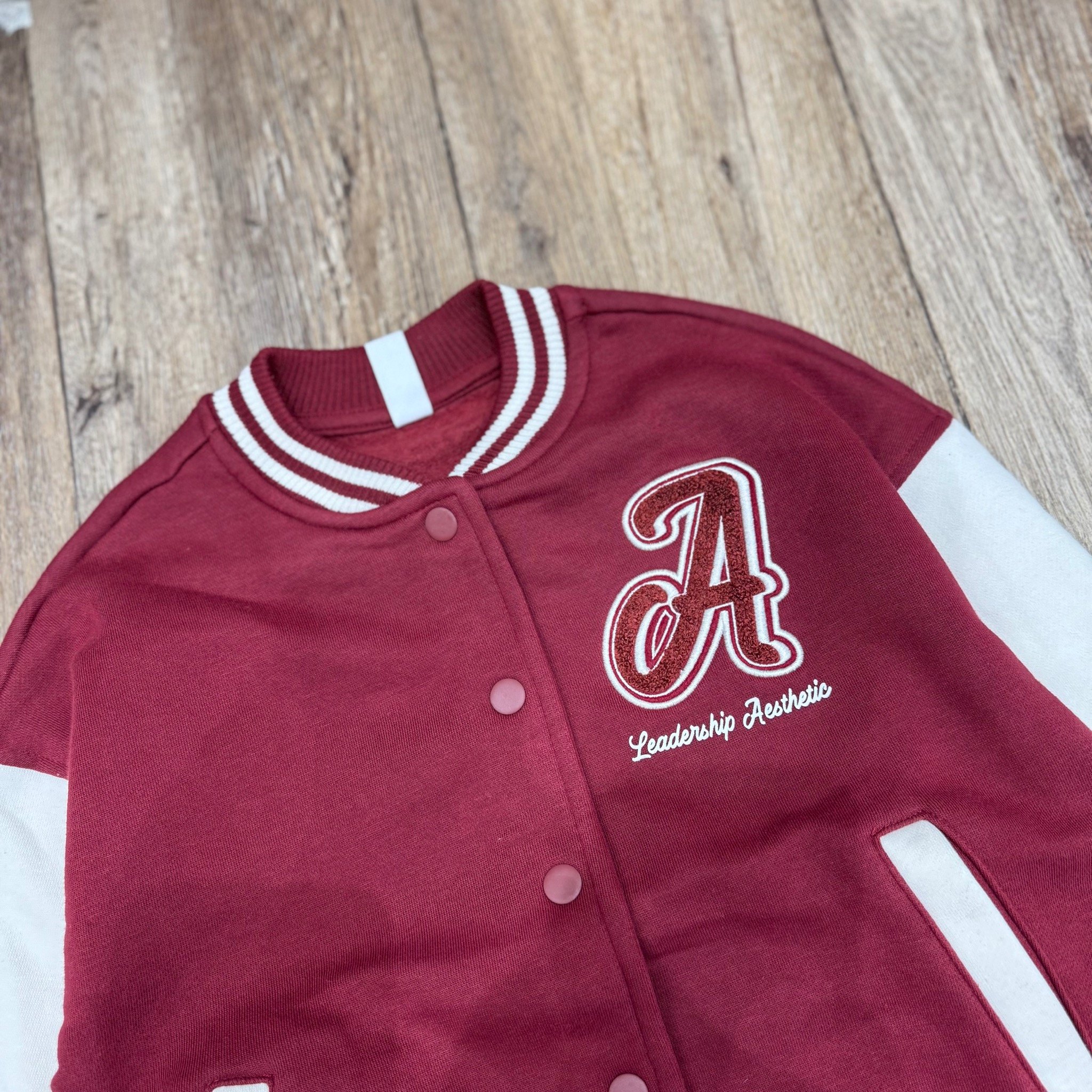 AKBT45 - Áo khoác bomber nỉ Sela 2 màu đen, đỏ đô cho bé size 122-164