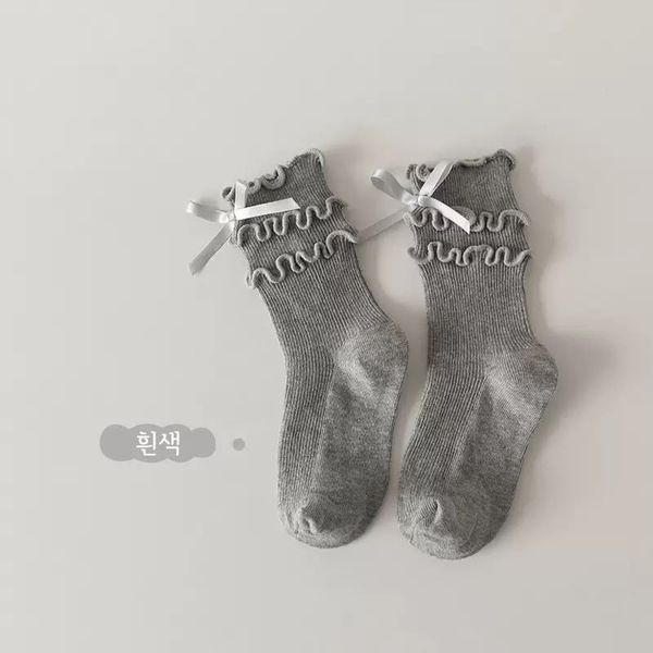 PK06 - Tất cao cổ bèo đính nơ 2 màu trắng/đen