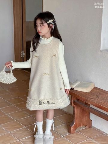 5261 - Set 2ct áo len tăm + váy dạ lót lông màu kem đính nơ bé gái size 120-160