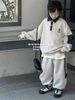 D312 - Bộ nỉ hai da cổ đức tay phối hai màu đen/be bé trai size 120-160