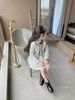 V00165 - Set áo khoác + chân váy dạ tweed kem phối đen size 1 - 10y