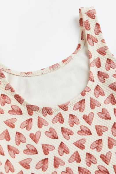 DB00021 - Bộ bơi liền màu kem hình tim nâu đỏ size 18m - 3y