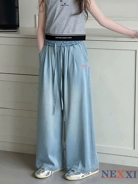2604.21 - Quần jean giấy Nexxi dài ống suông thêu nơ bé gái size 6-10y