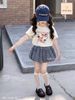 JJBCC.7528 - Set Jam&Jenny áo cotton trắng hình cún - chân váy bí caro xanh đính nơ size 2 - 12y