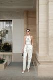  ÁO TRẮNG SỌC VÀNG THUN SÁT NÁCH + HOA VÀNG.   Golden Chain Knit Halter – A115419 