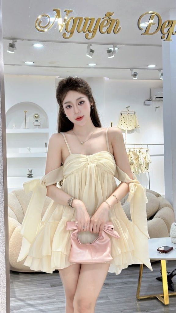 Đầm babydoll kem sữa dáng xoè tay rơi buộc nơ (K67)