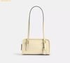 Túi Đeo Vai Coach Swing Zip Bag 20 CAN31 Trắng Kem