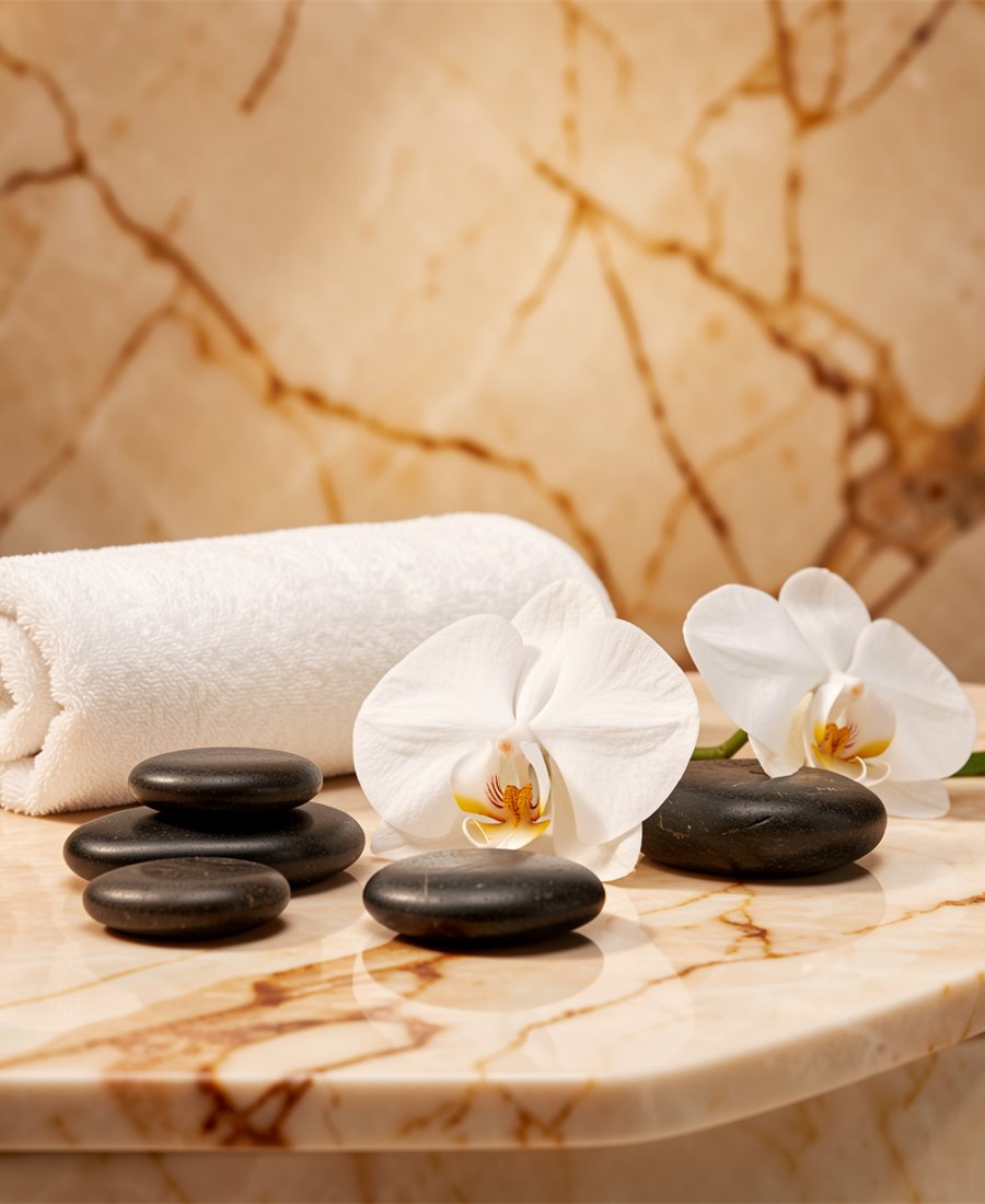 Đá nóng, hoa lan và chi tiết spa sang trọng